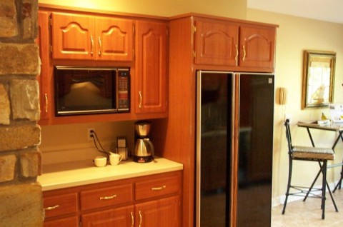 Open kitchen design features beautiful cabinets, sleek appliances, and much more!